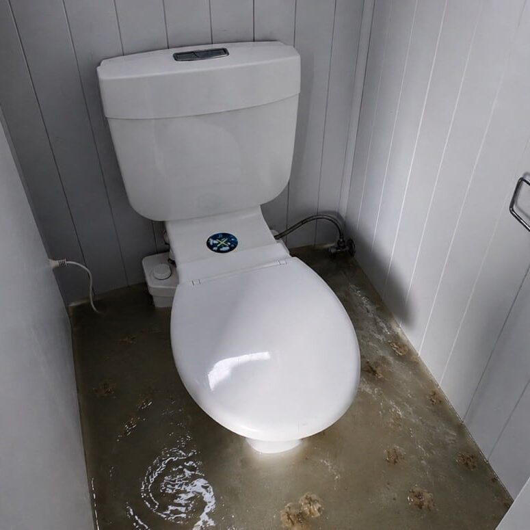 A flooded toilet in a transportable unit